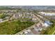 Neighborhood view with a small body of water, lots of green space, and several homes at 5119 Admiral Pointe Dr, Apollo Beach, FL 33572