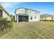 Backyard view featuring a large lawn at 5119 Admiral Pointe Dr, Apollo Beach, FL 33572