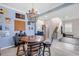 Cozy home bar area with a barrel table, bar stools, and easy access to other living spaces at 5119 Admiral Pointe Dr, Apollo Beach, FL 33572