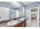 Bathroom featuring double sinks, granite countertop and plenty of space at 5119 Admiral Pointe Dr, Apollo Beach, FL 33572