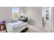 Comfortable bedroom with view to en-suite bathroom and big window at 5119 Admiral Pointe Dr, Apollo Beach, FL 33572