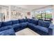 Inviting living room with a large, comfortable sectional couch and plenty of natural light at 5119 Admiral Pointe Dr, Apollo Beach, FL 33572