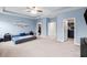 Expansive main bedroom with a walk-in closet and an ensuite bathroom provides a luxurious retreat at 5119 Admiral Pointe Dr, Apollo Beach, FL 33572