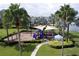 Community playground features a covered play structure with slides and a swing set near a gazebo at 5119 Admiral Pointe Dr, Apollo Beach, FL 33572