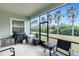 Screened patio featuring grill, minifridge and outdoor seating area at 5119 Admiral Pointe Dr, Apollo Beach, FL 33572