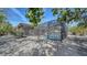 Backyard view of pool with full enclosure and rock landscaping at 5525 Shadow Lawn Dr, Sarasota, FL 34242