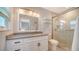 Modern bathroom with a glass-enclosed shower, sleek vanity, and contemporary finishes at 5525 Shadow Lawn Dr, Sarasota, FL 34242