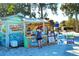 Beach stand serving drinks and renting beach equipment near a sandy area with beachgoers at 5525 Shadow Lawn Dr, Sarasota, FL 34242