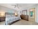 Comfortable bedroom with neutral walls, ceiling fan, and a large dresser at 5525 Shadow Lawn Dr, Sarasota, FL 34242