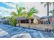 Tropical-themed restaurant with bamboo accents, palm trees, and parking area at 5525 Shadow Lawn Dr, Sarasota, FL 34242