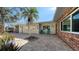 This beautiful home has a brick and siding exterior, paved driveway, and well-maintained landscaping at 5525 Shadow Lawn Dr, Sarasota, FL 34242