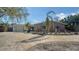 Attractive brick and siding home with a beautiful paved driveway and a tropical landscaped front yard at 5525 Shadow Lawn Dr, Sarasota, FL 34242