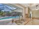 Stylish kitchen counter overlooking the pool area, offering a seamless indoor-outdoor living experience at 5525 Shadow Lawn Dr, Sarasota, FL 34242