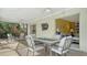 Screened patio with a dining table and view to the interior at 5525 Shadow Lawn Dr, Sarasota, FL 34242