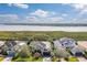 Aerial shot of a home surrounded by manicured landscaping near a serene body of water at 5608 Tidewater Preserve Blvd, Bradenton, FL 34208