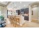 Kitchen with a large island, counter seating, stainless steel appliances, and pendant lighting at 5608 Tidewater Preserve Blvd, Bradenton, FL 34208