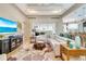 Inviting living room featuring hardwood floors, recessed lighting, comfortable seating, and an open layout to the kitchen at 5608 Tidewater Preserve Blvd, Bradenton, FL 34208