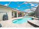 Beautiful backyard showcasing a sparkling pool, screened enclosure, and outdoor seating area at 5608 Tidewater Preserve Blvd, Bradenton, FL 34208