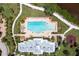 Bird's eye view of community pool and recreation area with palm trees, lounge chairs, and beautiful landscaping at 5608 Tidewater Preserve Blvd, Bradenton, FL 34208