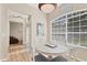 Light-filled breakfast nook featuring a round table and large window, perfect for enjoying morning meals at 5655 Downham Mdws, Sarasota, FL 34235