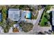 Aerial view of a single Gathering home with a private pool and long drive way at 614 Tropical Cir, Sarasota, FL 34242