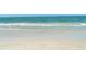Clear beach water with white sand and waves at 614 Tropical Cir, Sarasota, FL 34242