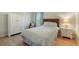 Cozy bedroom with a classic wardrobe and complementary nightstand at 614 Tropical Cir, Sarasota, FL 34242