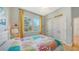 Inviting bedroom featuring ample natural light, ceiling fan and double closets at 614 Tropical Cir, Sarasota, FL 34242