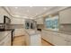 Well-lit kitchen featuring modern appliances and a center island at 614 Tropical Cir, Sarasota, FL 34242