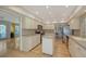 Modern kitchen with white cabinets, stainless steel appliances, and an island at 614 Tropical Cir, Sarasota, FL 34242