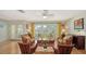 Bright and airy living room with natural light, hardwood floors, and stylish decor at 614 Tropical Cir, Sarasota, FL 34242