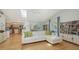 Bright and airy living room leading to the kitchen and dining area at 614 Tropical Cir, Sarasota, FL 34242