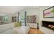 Comfortable living room with a fireplace and built-in bookcases at 614 Tropical Cir, Sarasota, FL 34242