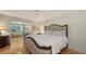 Bright and airy main bedroom featuring a large window and a sitting area with a comfortable bench at 614 Tropical Cir, Sarasota, FL 34242