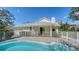 Beautiful backyard pool with a white fence providing added security and privacy at 614 Tropical Cir, Sarasota, FL 34242