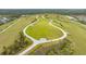 An expansive community recreation area with walking trails, green space, and playgrounds on rolling hills at 6378 Grandview Hill Ct, Bradenton, FL 34203