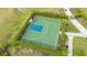 Aerial view of community basketball court, surrounded by manicured landscaping, inviting recreation and community engagement at 6378 Grandview Hill Ct, Bradenton, FL 34203