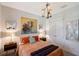Charming bedroom with tasteful decor, a decorative chandelier, and plenty of natural light at 6378 Grandview Hill Ct, Bradenton, FL 34203