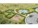 Community featuring a playground, tennis courts, pool, and lush green spaces offers recreation and leisure at 6378 Grandview Hill Ct, Bradenton, FL 34203