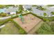 Aerial view of the community playground, with modern equipment, lush landscaping, and a welcoming atmosphere at 6378 Grandview Hill Ct, Bradenton, FL 34203