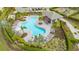 An inviting community pool with ample lounge seating, shady pergola, and lush tropical landscaping at 6378 Grandview Hill Ct, Bradenton, FL 34203