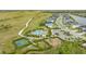 Aerial view of the community highlighting amenities, walking path, pool area, and lush landscaping at 6378 Grandview Hill Ct, Bradenton, FL 34203