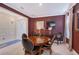 Inviting dining room with a round wooden table, leather chairs, and stylish decor at 6378 Grandview Hill Ct, Bradenton, FL 34203