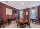 Formal dining room with decorative lamps, a wooden table, and comfortable seating at 6378 Grandview Hill Ct, Bradenton, FL 34203