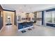 This kitchen features white cabinets, stainless steel appliances, a large island and lovely hanging lights at 6378 Grandview Hill Ct, Bradenton, FL 34203