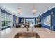 Bright kitchen showcasing a large island, pendant lighting, and an open layout leading to the cozy living room at 6378 Grandview Hill Ct, Bradenton, FL 34203