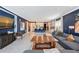 Open-concept living room showcasing stylish decor, tile floors, comfortable seating, and kitchen access at 6378 Grandview Hill Ct, Bradenton, FL 34203