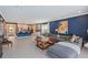 Open-concept living room showcasing the kitchen with a large sectional sofa and stylish decor at 6378 Grandview Hill Ct, Bradenton, FL 34203
