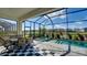 Relaxing screened-in pool and spa with a view of the tranquil lake and backyard at 6378 Grandview Hill Ct, Bradenton, FL 34203