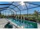 Lake view from a serene pool and hot tub in a screened-in lanai at 6378 Grandview Hill Ct, Bradenton, FL 34203